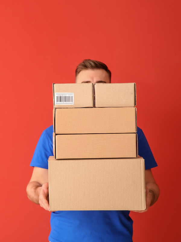 Man holding shipping boxes